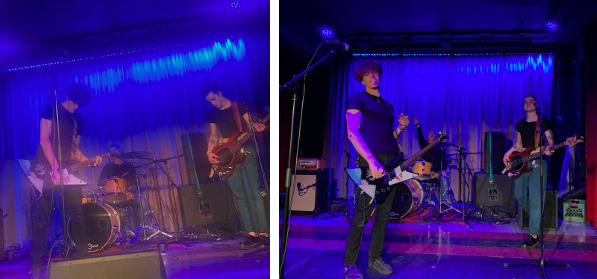 Noah, Carson, and Chris performing on stage with neon blue lights